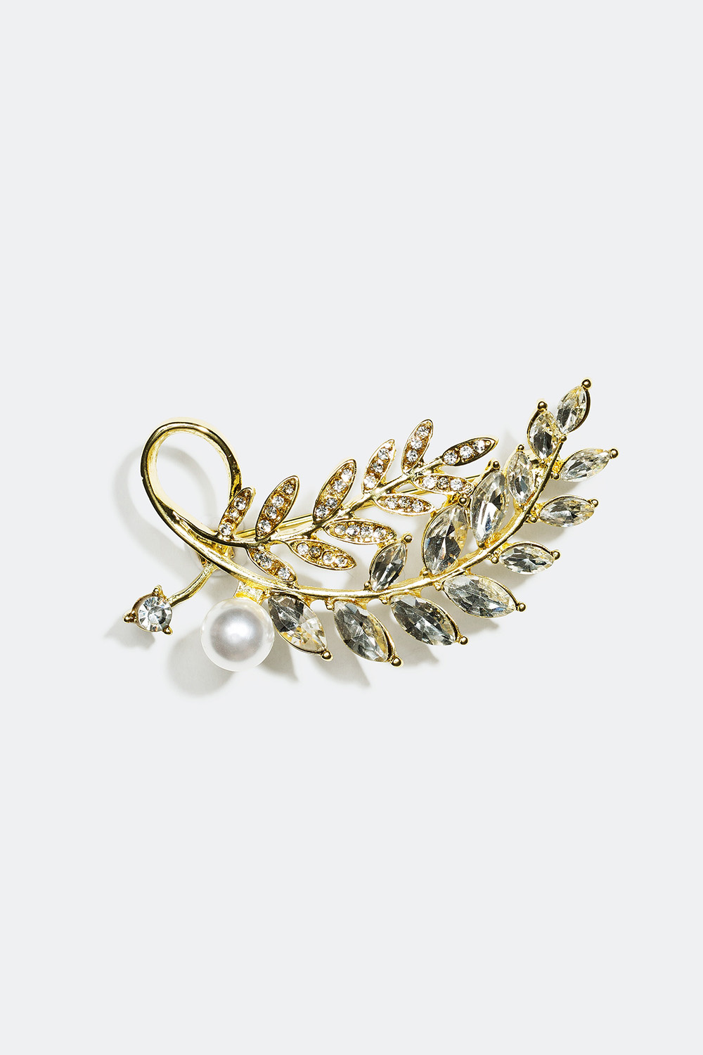 Rintakoru, jossa lehtiaihe ja lasikiviä