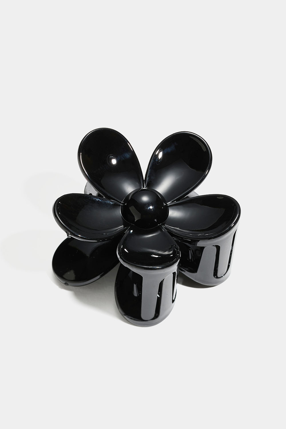 Musta kukanmuotoinen hiusklipsi