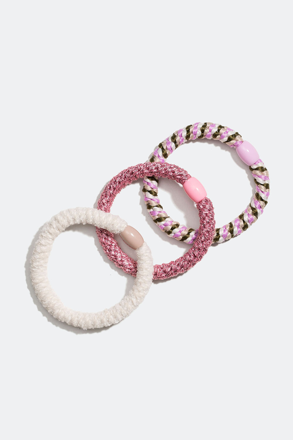 Sekoitus vaaleanpunaisia, valkoisia ja viheitä punottuja hiuslenkkejä, 3 kpl