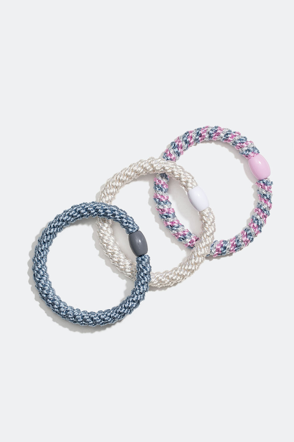 Sekoitus vaaleanpunaisia ja valkoisia punottuja hiuslenkkejä, 3 kpl