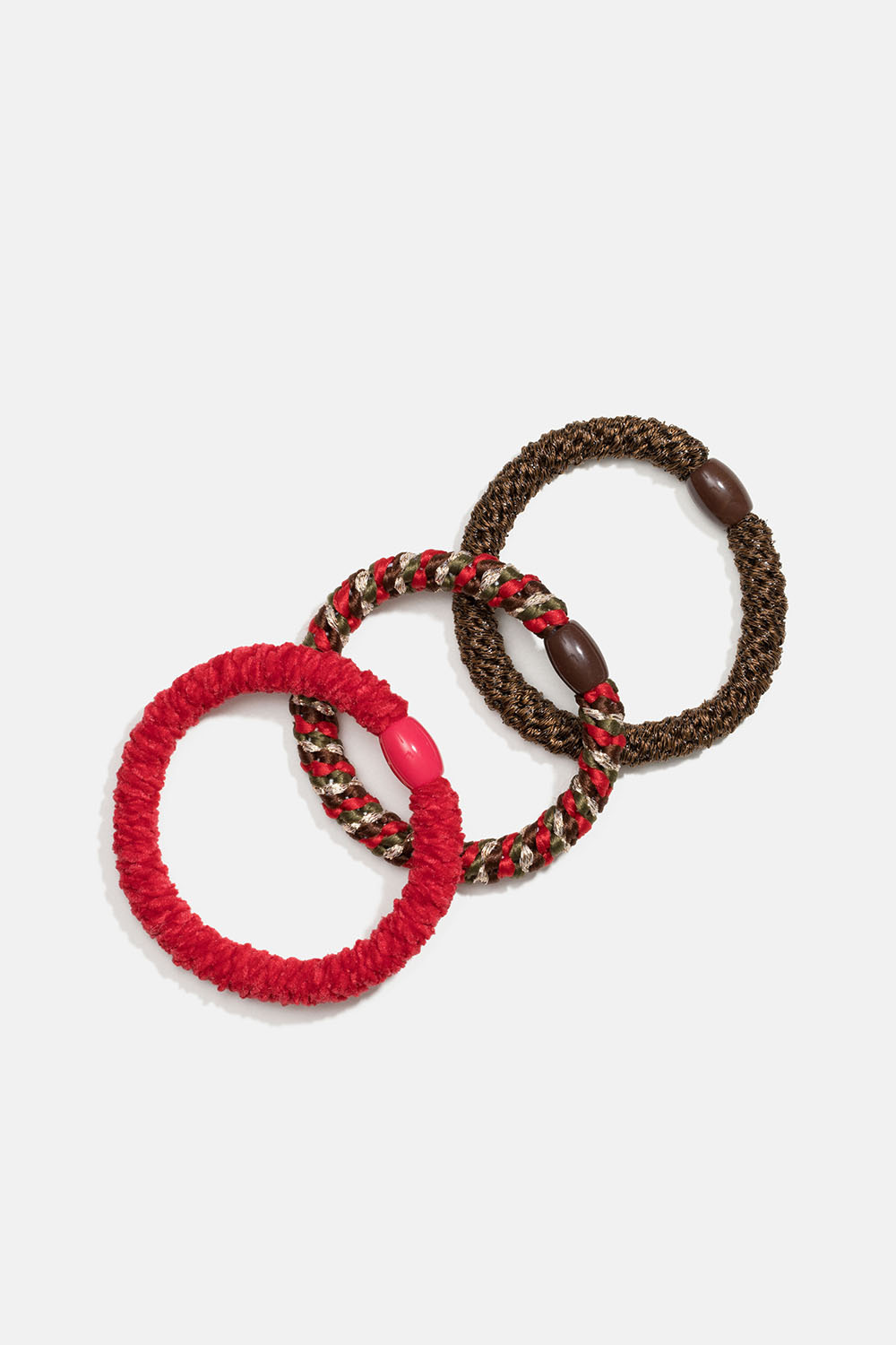 Sekoitus ruskeita ja punaisia punottuja hiuslenkkejä, 3 kpl