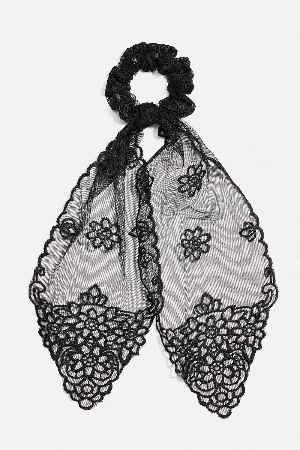 Musta hännällinen hiusdonitsi pitsiä