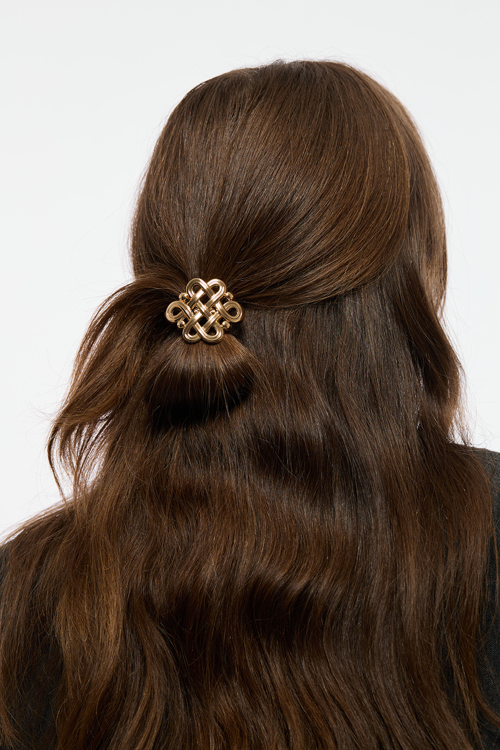 Hiuslenkki, jossa metallinen kultakoriste