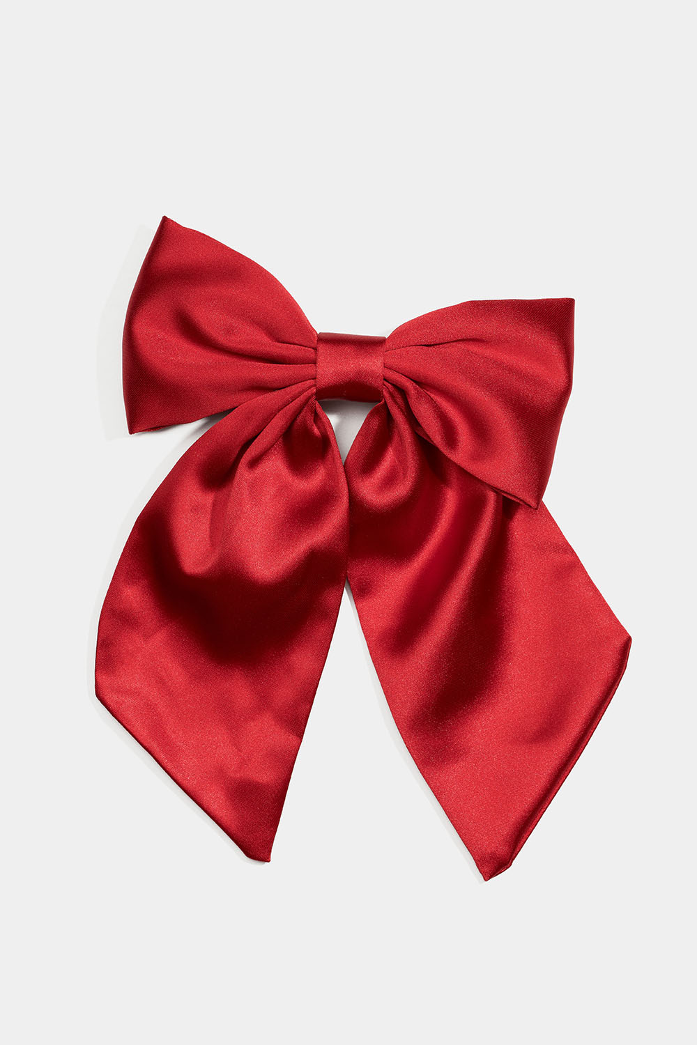 Hiussolki, jossa on punaisesta keinosilkistä valmistettu rusetti