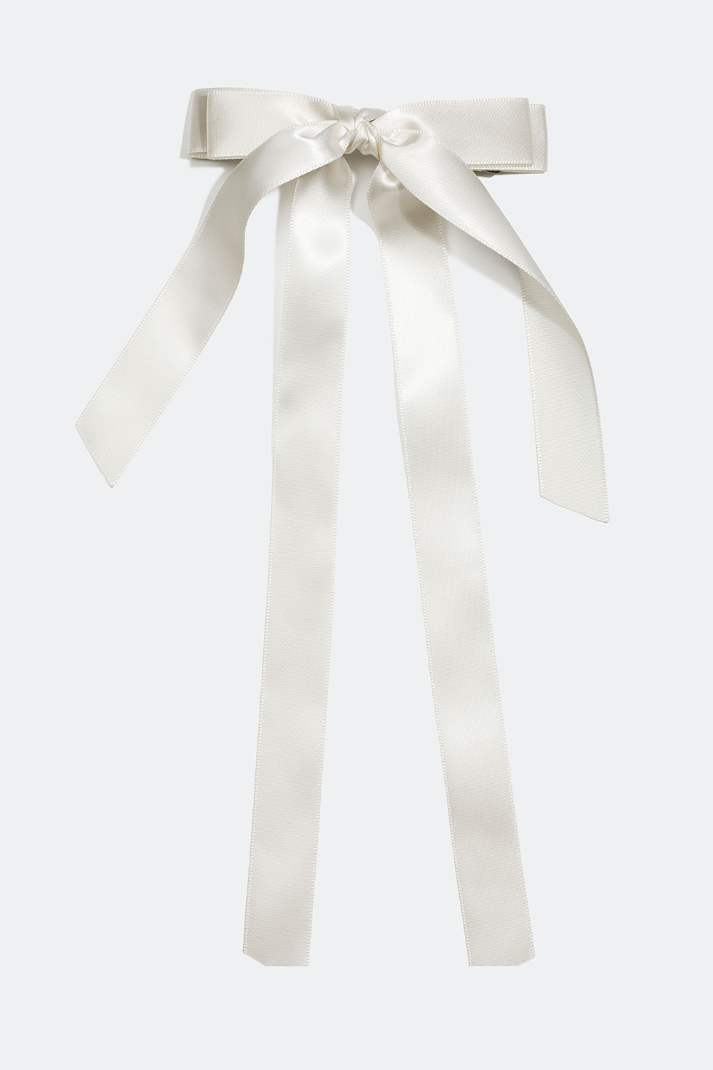 Hiussolki, jossa valkoinen rusetti