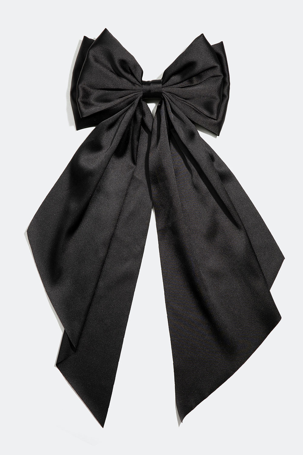 Hiussolki, jossa suuri, mustasta keinosilkistä valmistettu rusetti