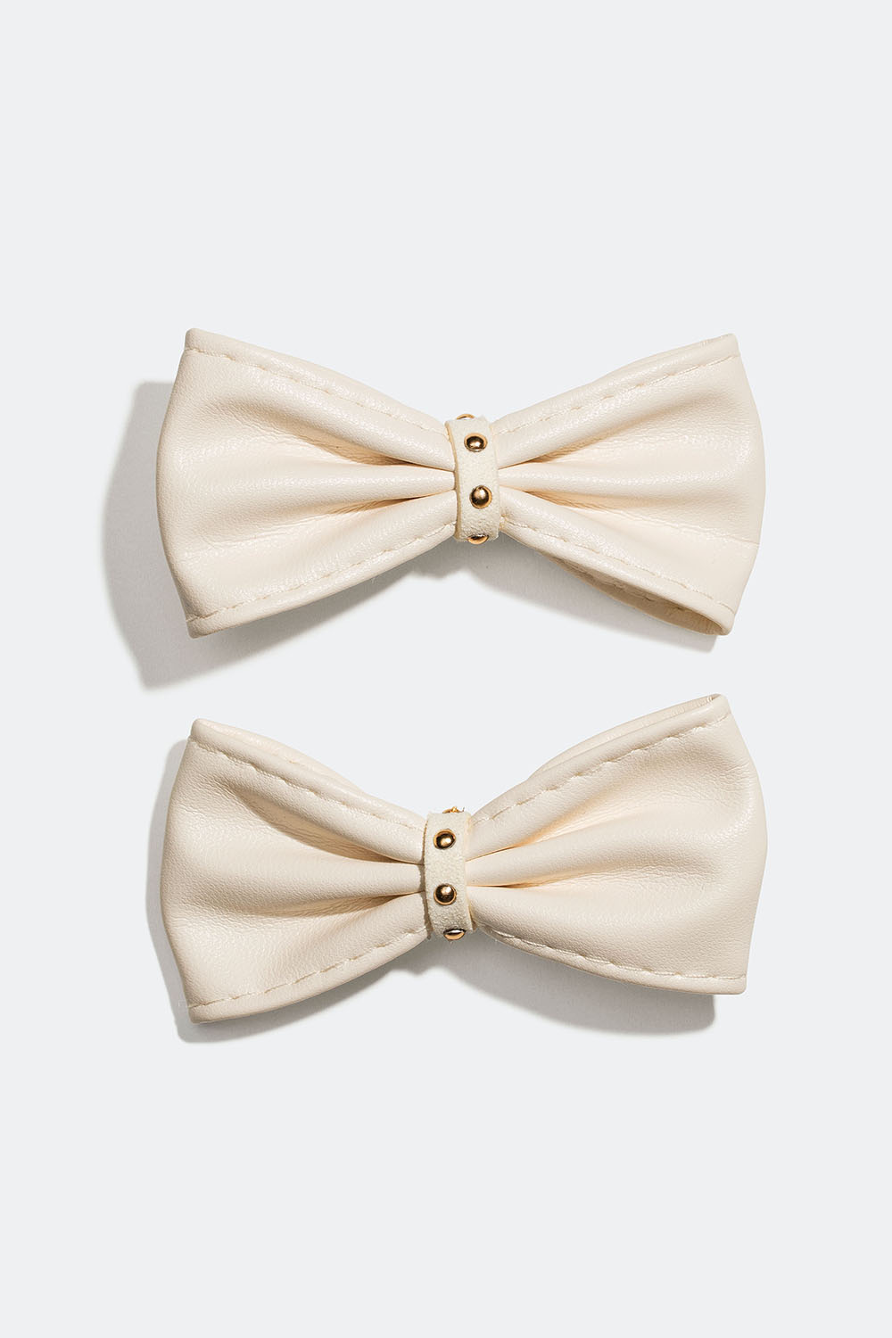 Hiussolki, jossa valkoisesta keinonahasta valmistettuja rusetteja, 2 kpl