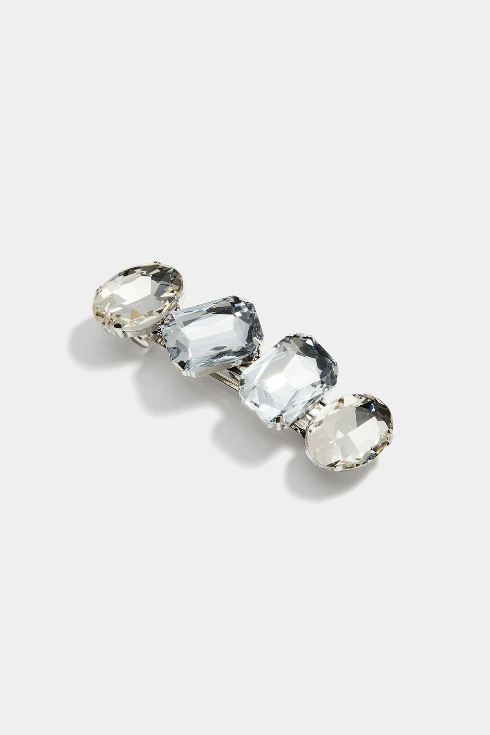 Hiusklipsi, jossa on isoja valkoisia lasikiviä