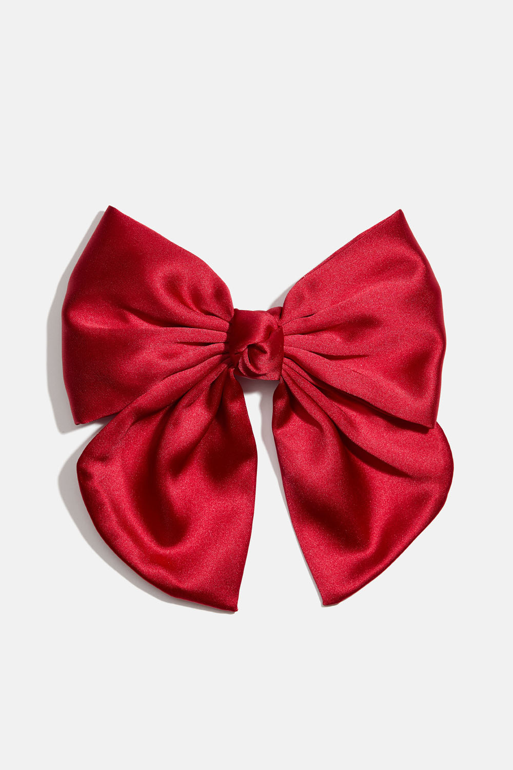 Hiussolki, jossa punainen rusetti ja solmu