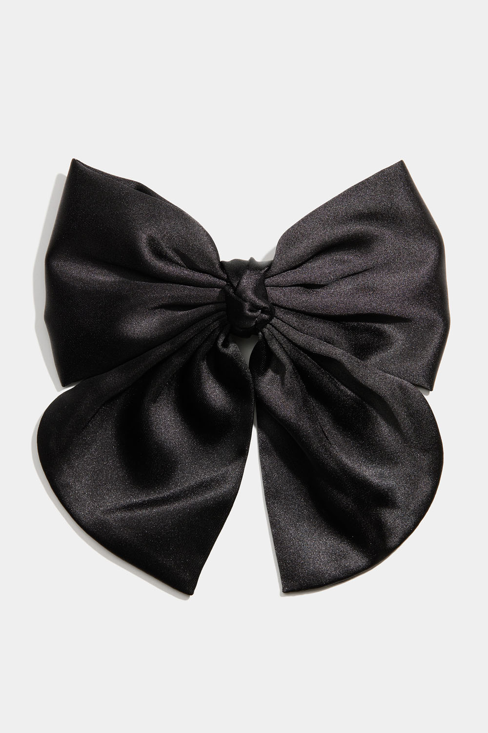 Hiussolki, jossa musta rusetti ja solmu