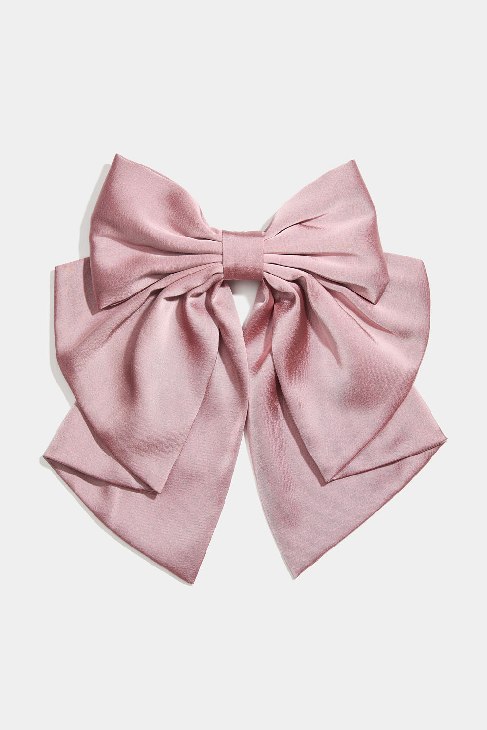 Vaaleanpunainen hiussolki, jossa rusetti ja nauha