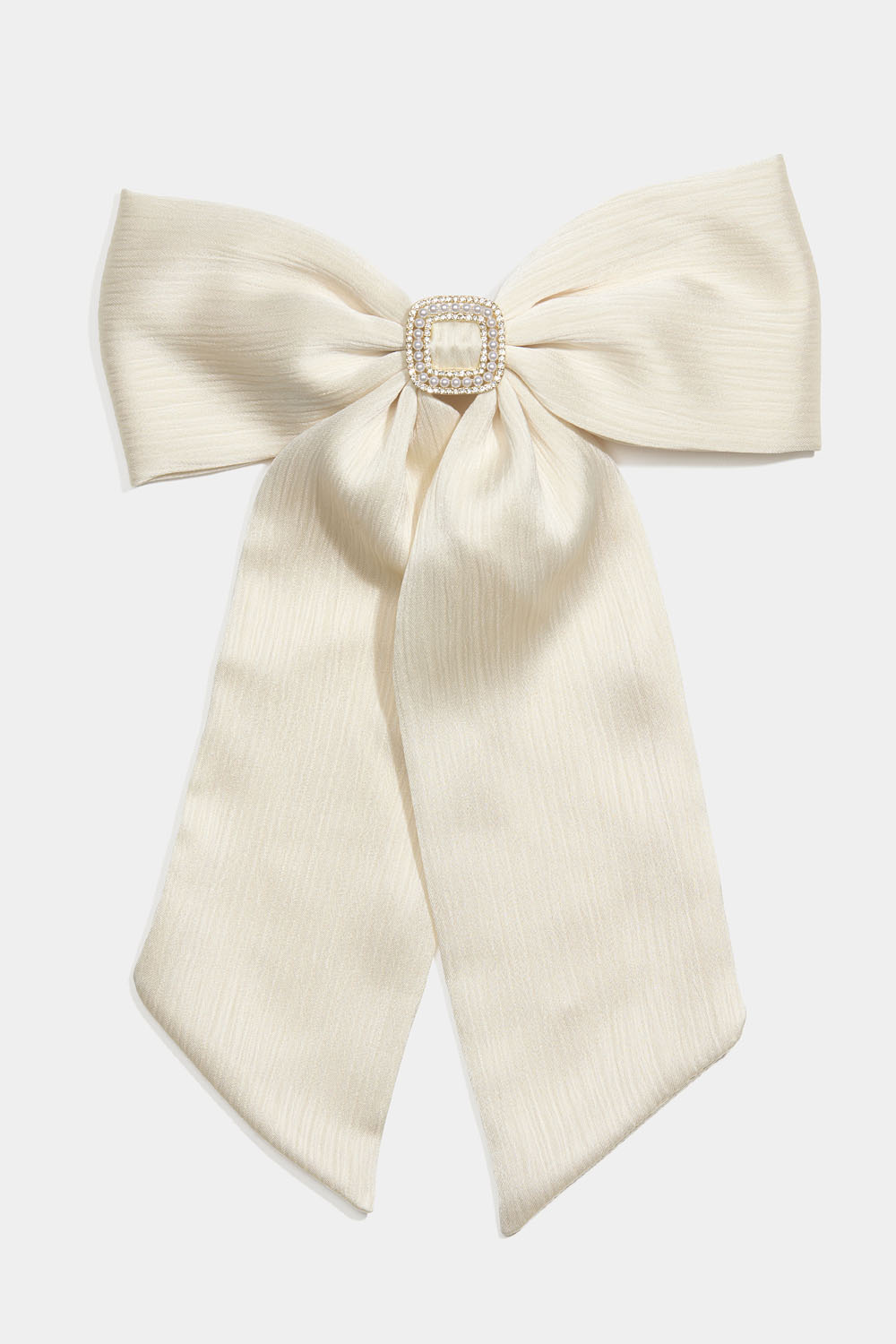 Hiussolki, jossa valkoinen rusetti ja strasseja