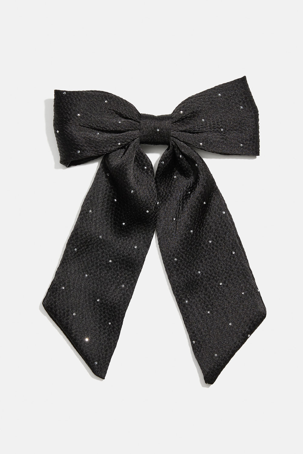 Hiussolki, jossa musta rusetti ja pieniä niittejä