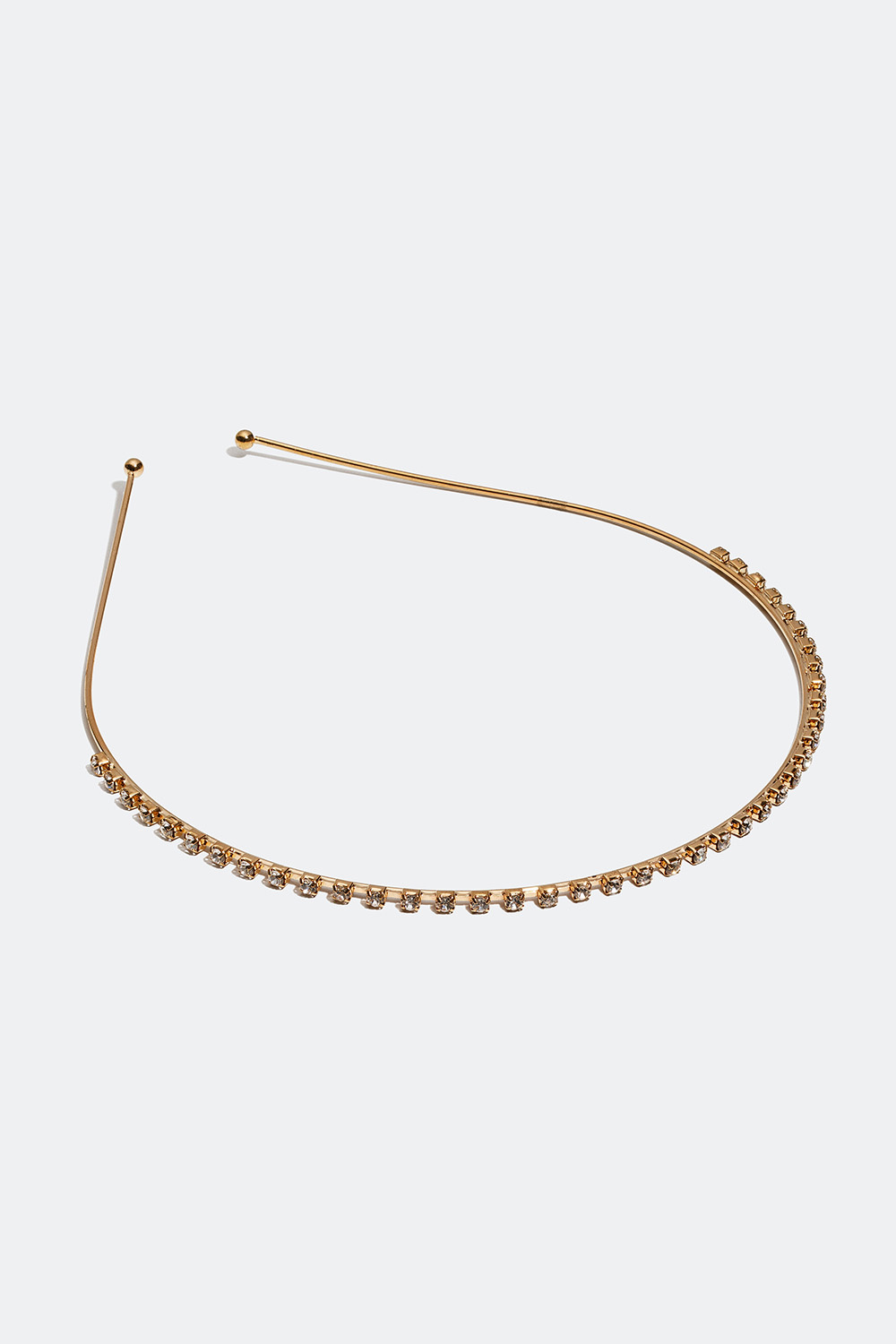 Kullanvärinen hiuspanta, jossa on lasikiviä