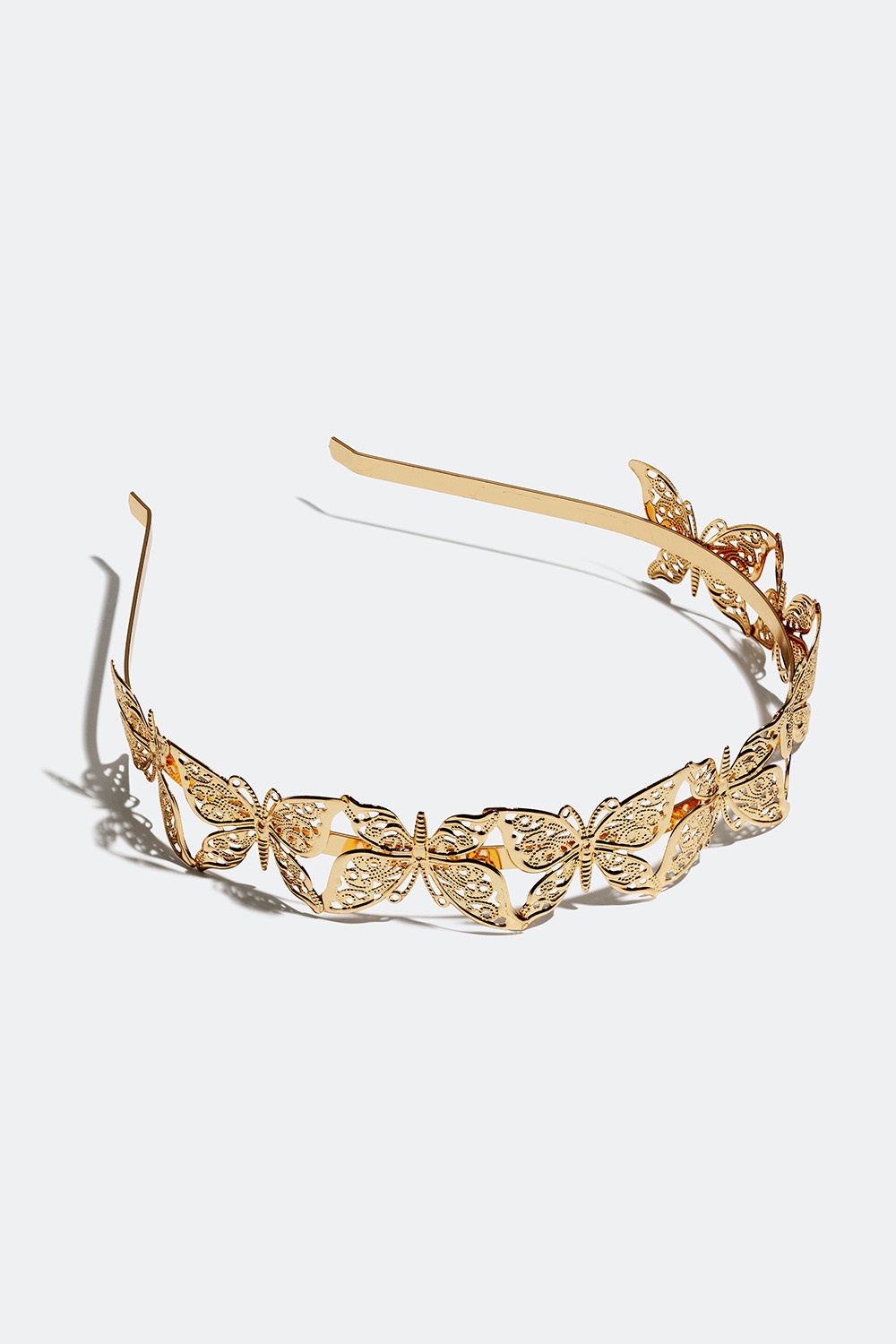 Kullanvärinen hiuspanta, jossa perhosia