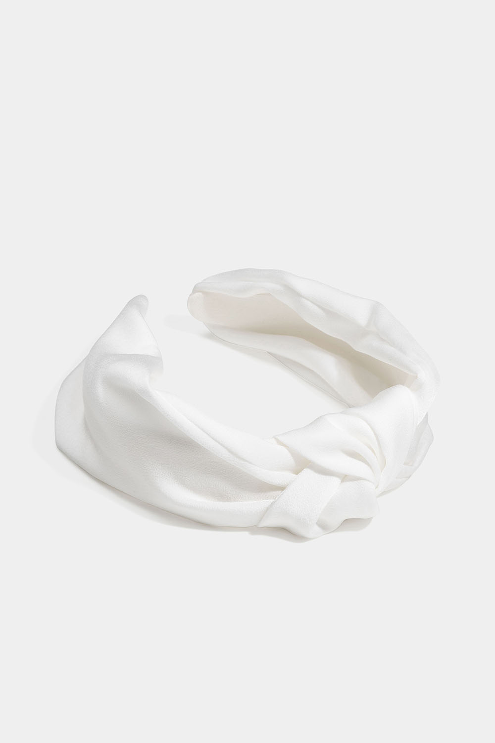 Valkoinen hiuspanta keinosilkkiä koristesolmulla