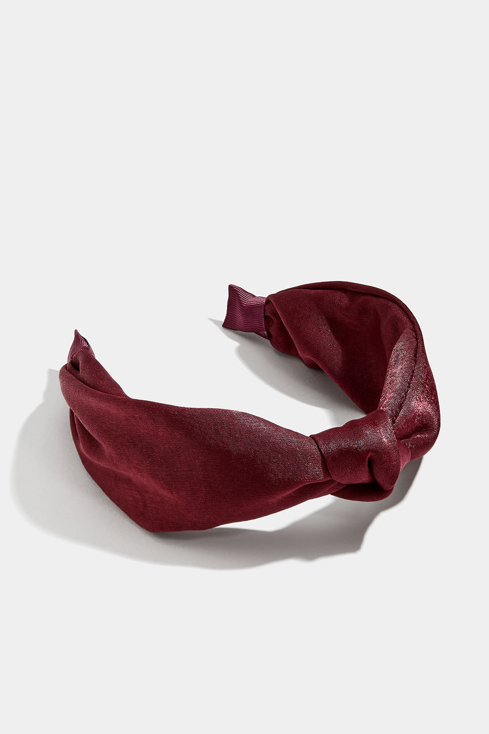 Viininpunainen hiuspanta, jossa solmu