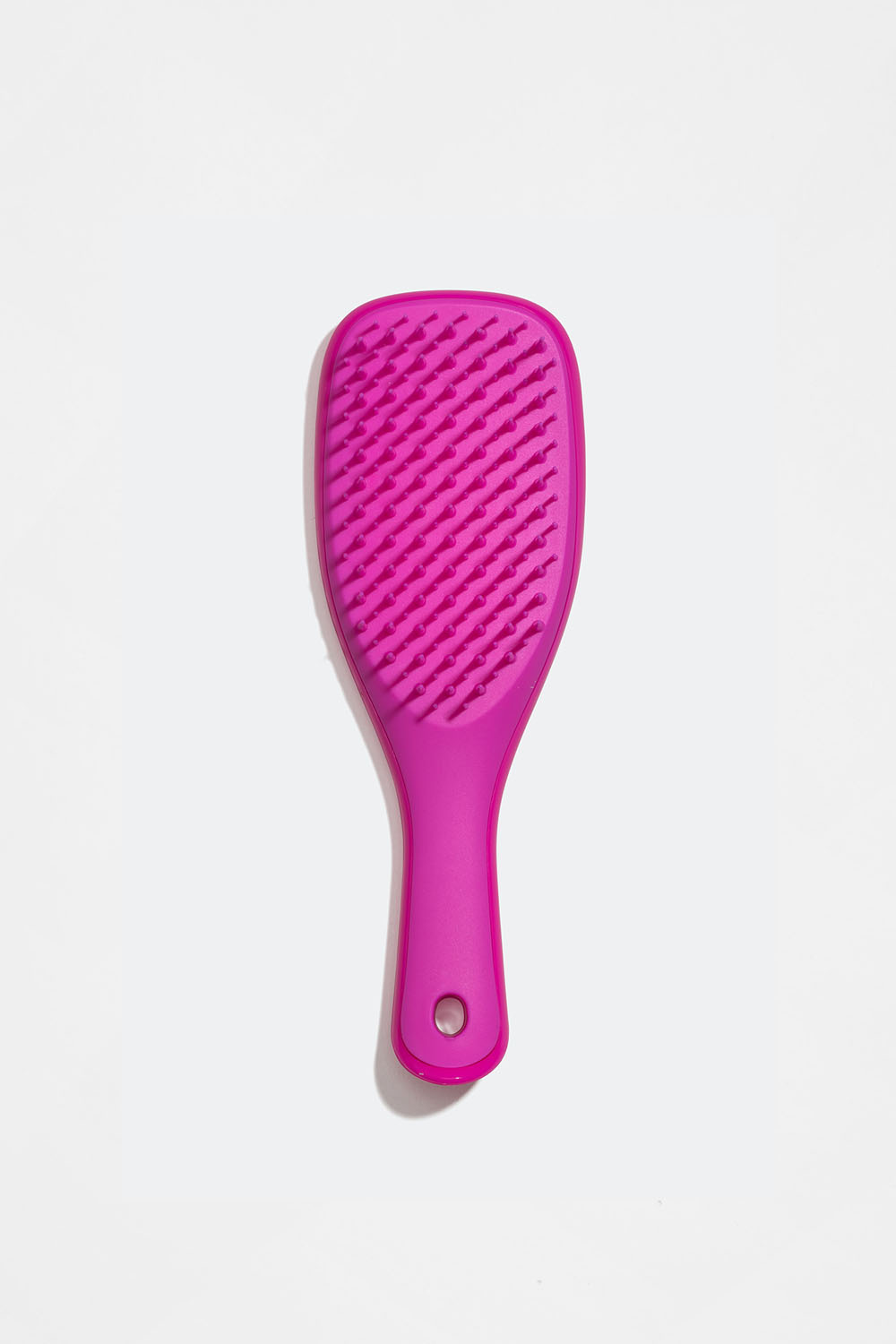 Pieni vaaleanpunainen detangler-hiusharja