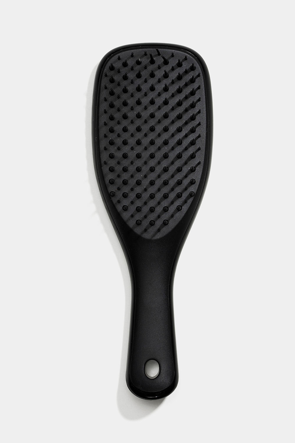 Pieni musta detangler-hiusharja