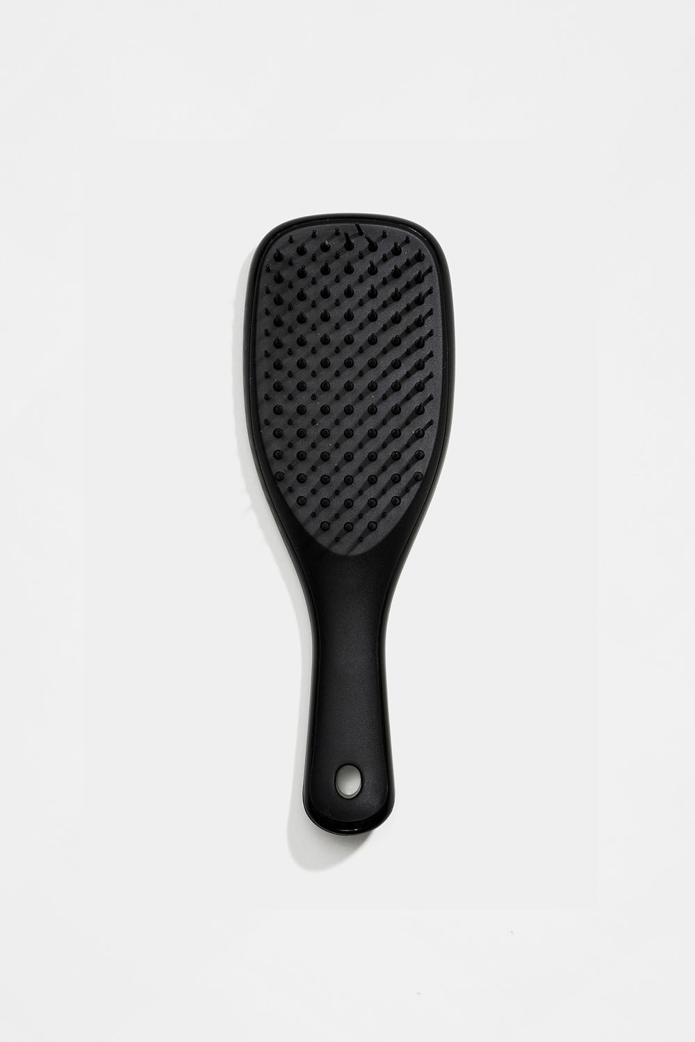 Pieni musta detangler-hiusharja