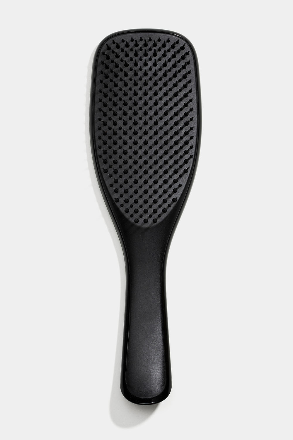 Musta detangler-hiusharja