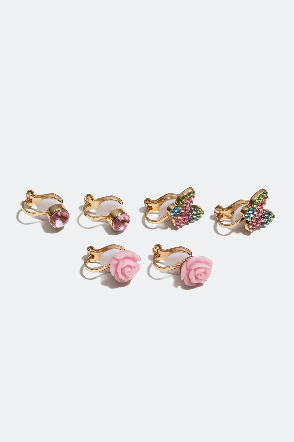 Klipsikorvakorut, joissa vaaleanpunaisia lasikiviä, kukkia ja perhosia, 3 paria