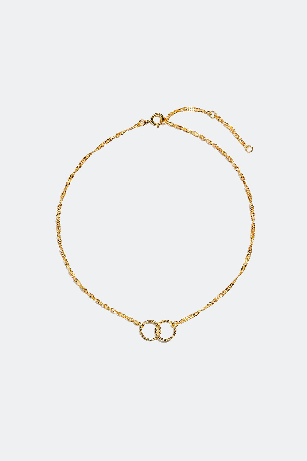 Hopeinen nilkkakoru kierteellä ja kahdella renkaalla