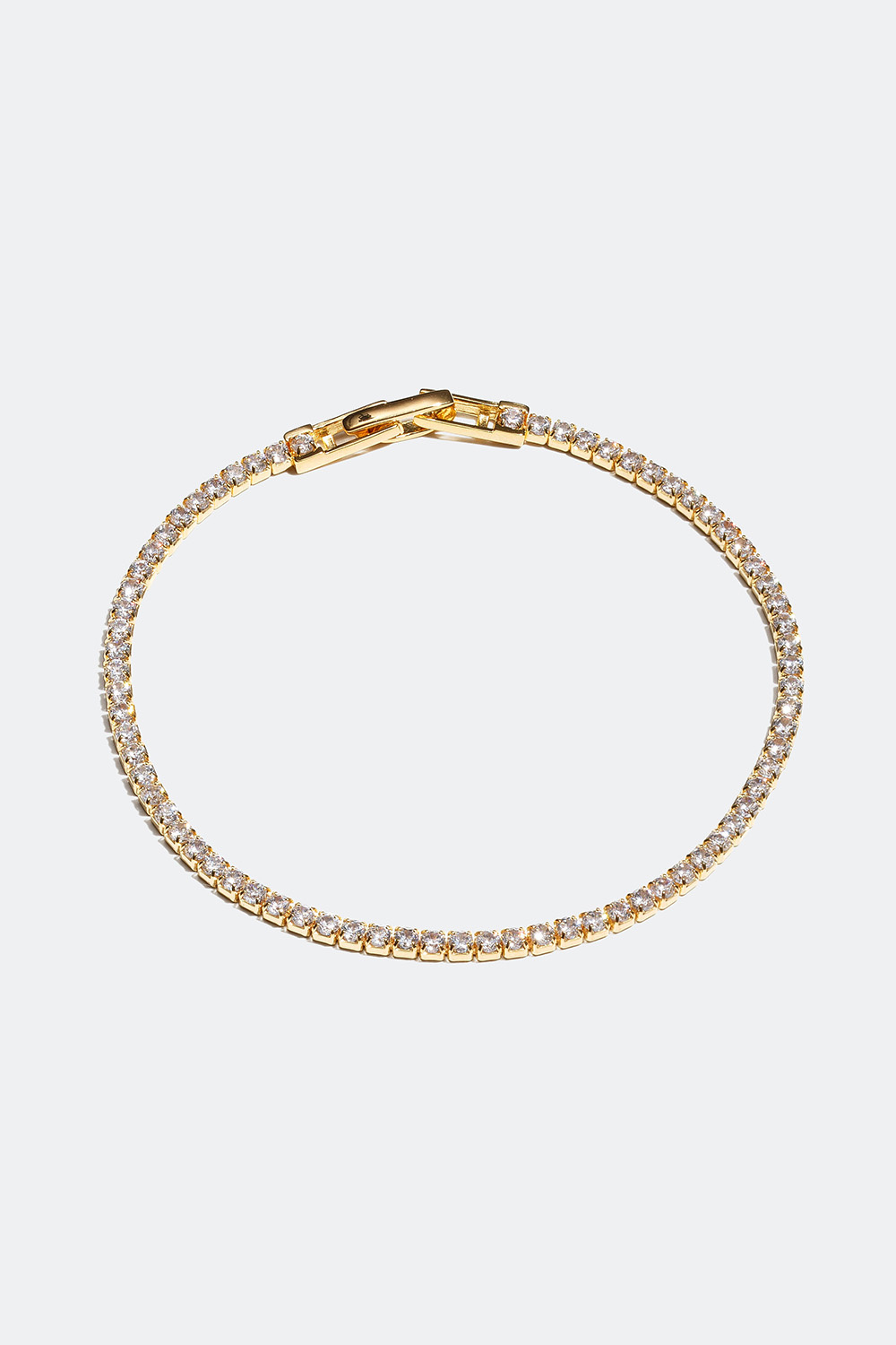 Kapea tennisrannekoru, jossa on Cubic Zirconia -kiviä ja 18 karaatin kultaus