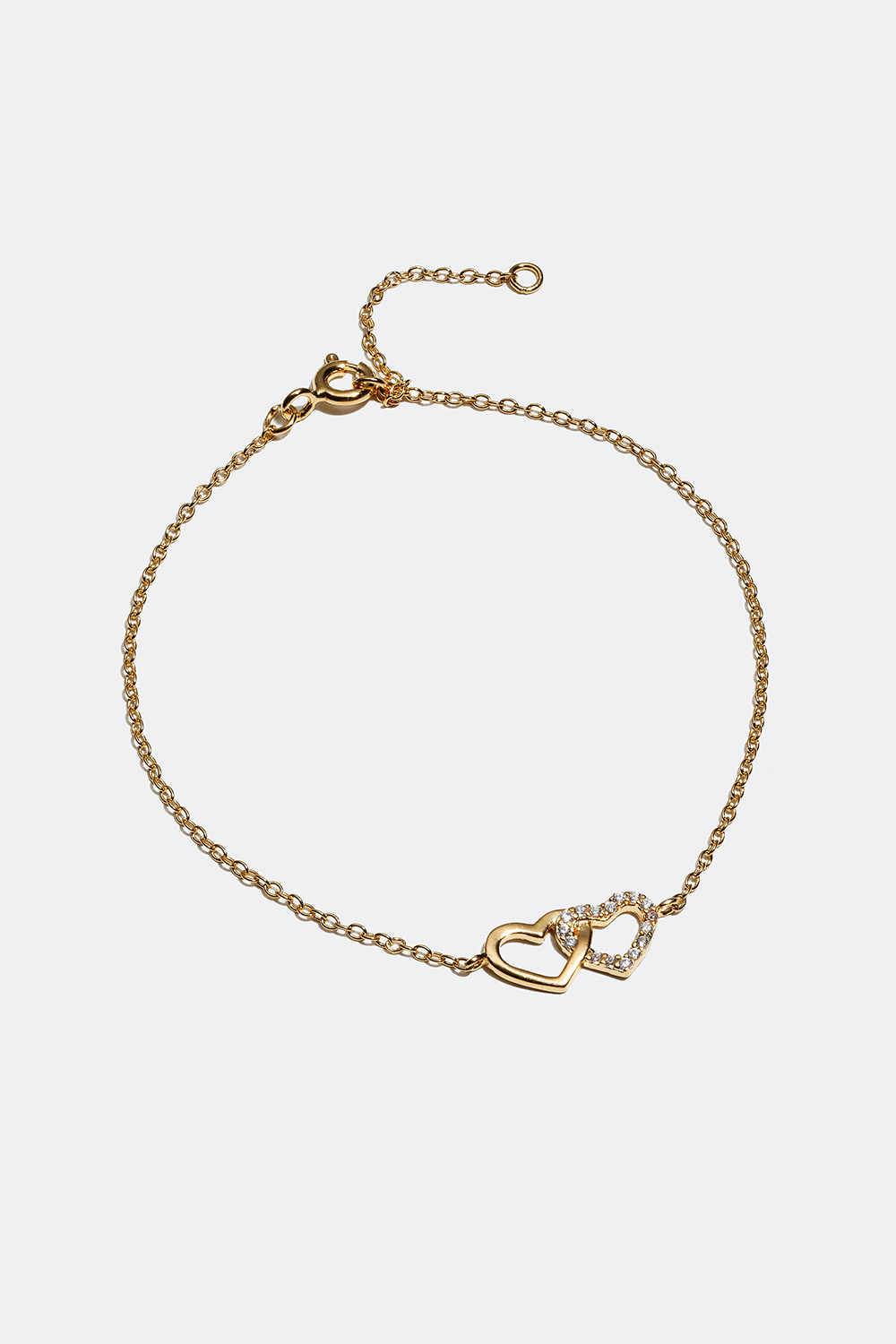 Ohut rannekoru, jossa 18 karaatin kultaus ja sydämiä