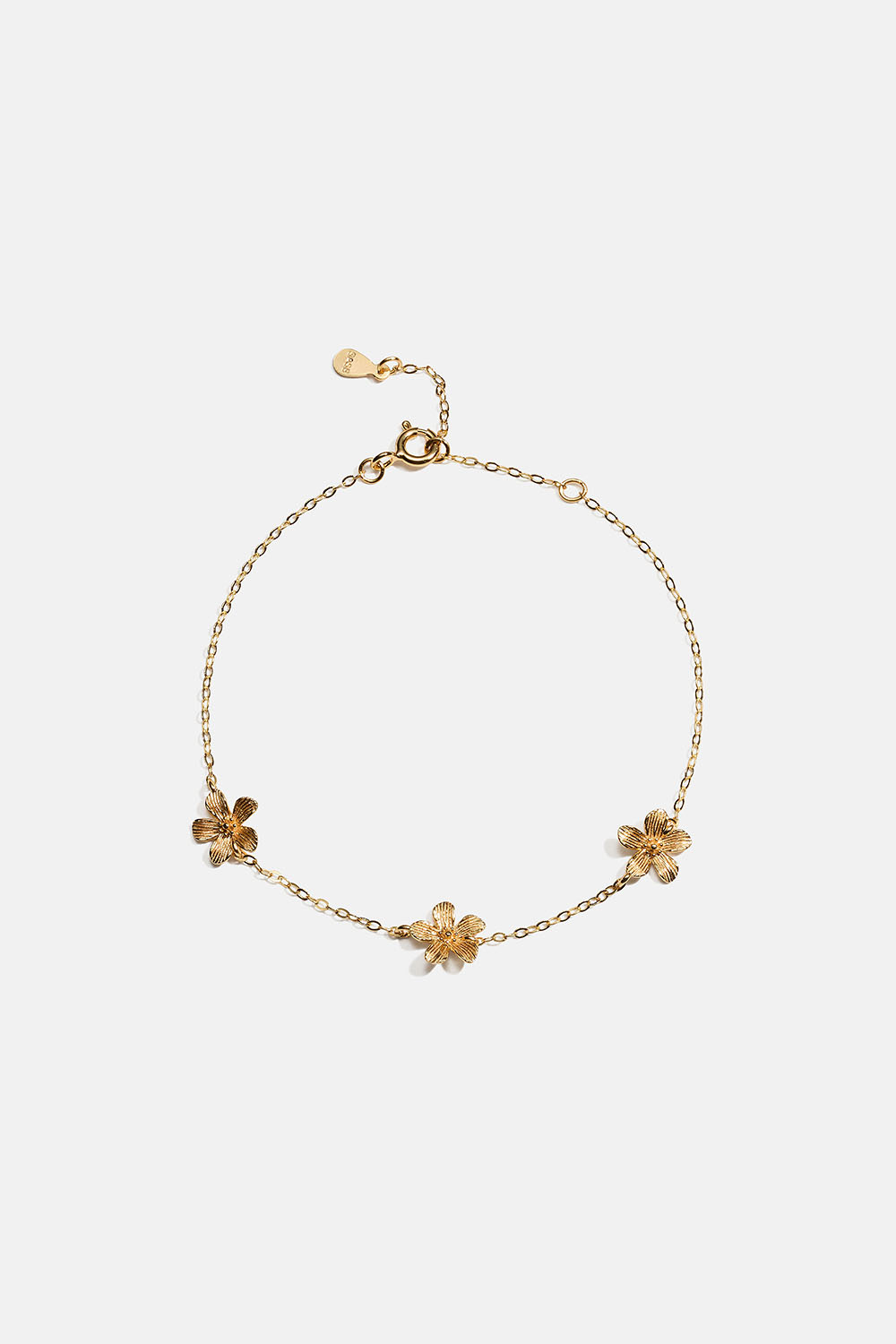 Aito 18k kullattu hopearannekoru, jossa teksturoituja kukkia