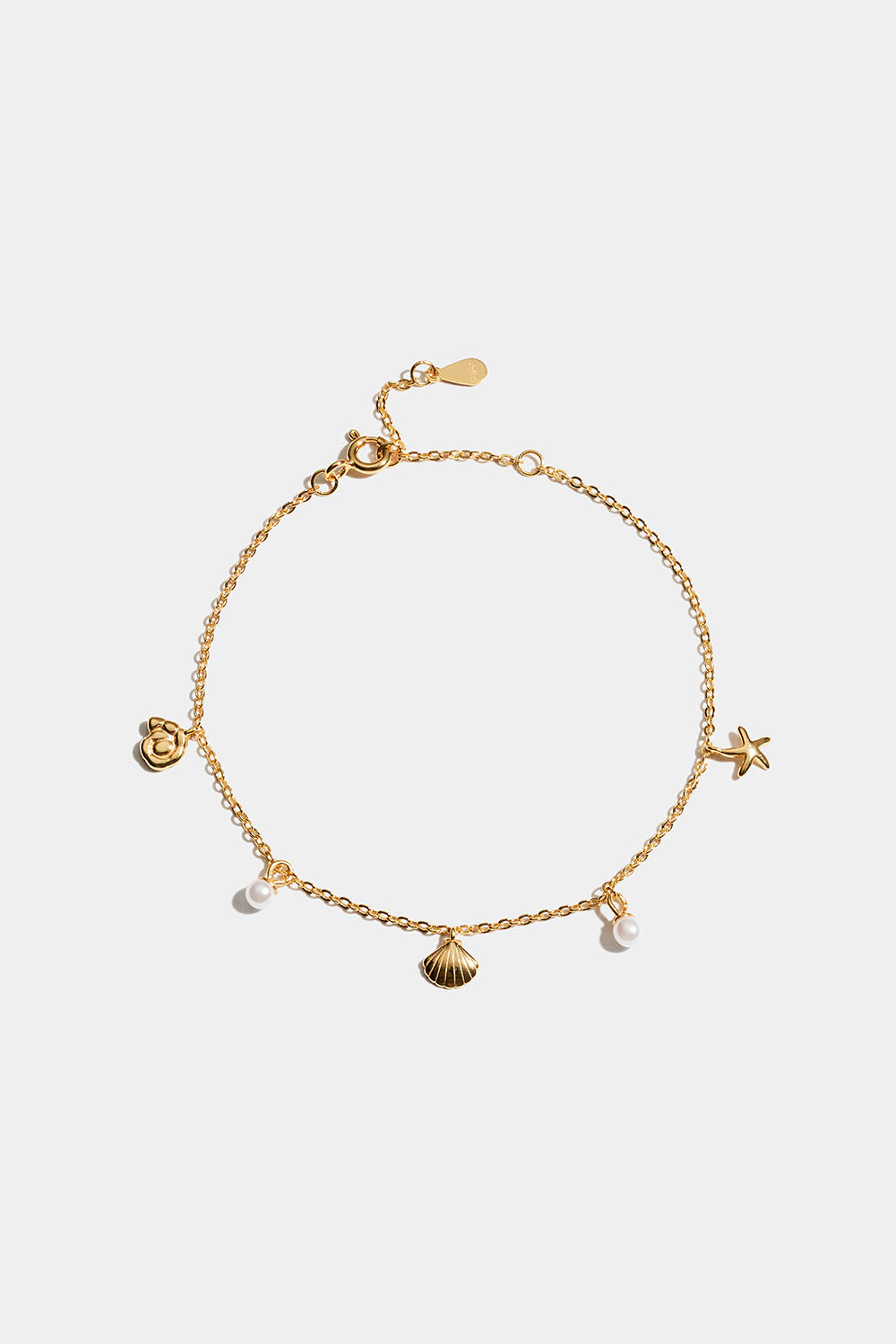 18k kullalla kullatusta hopeasta valmistettu rannekoru, jossa on meririipuksia.