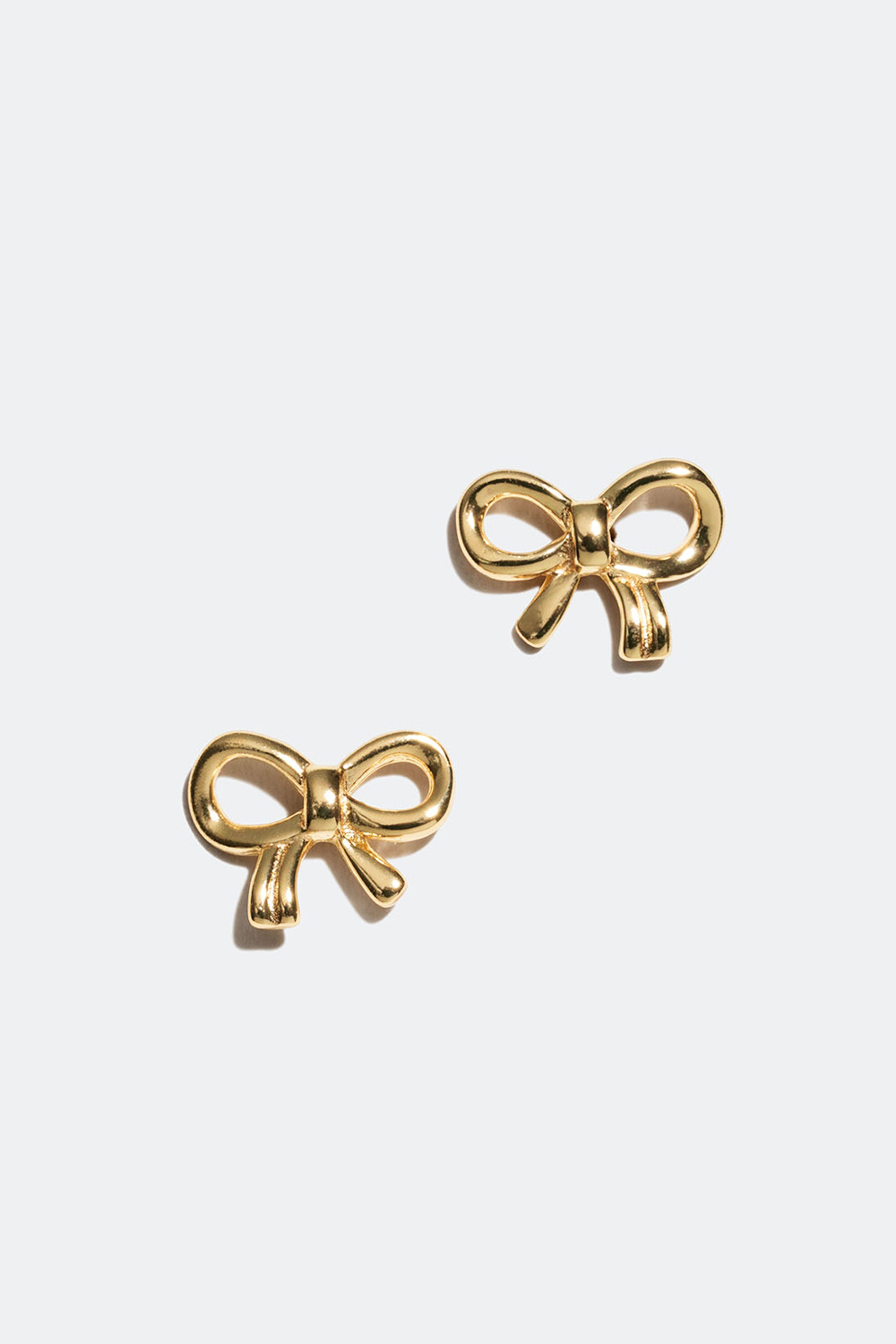 Korvakorut aitoa hopeaa 18k kultauksella ja ruseteilla