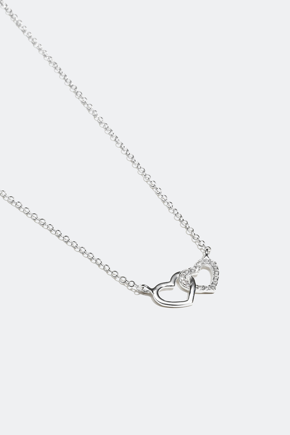 Aito hopeakaulakoru, jossa kaksi sydäntä