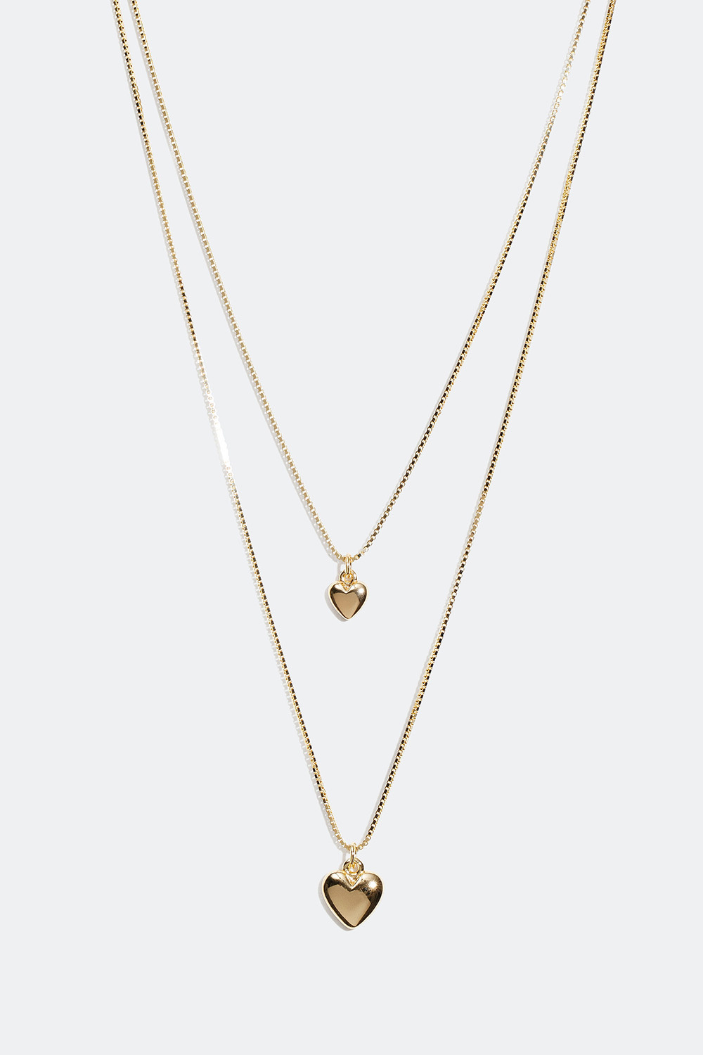 Kaulakoru, jossa on aidosta hopeasta valmistettu sydän 18 karaatin kultauksella - Mini me set