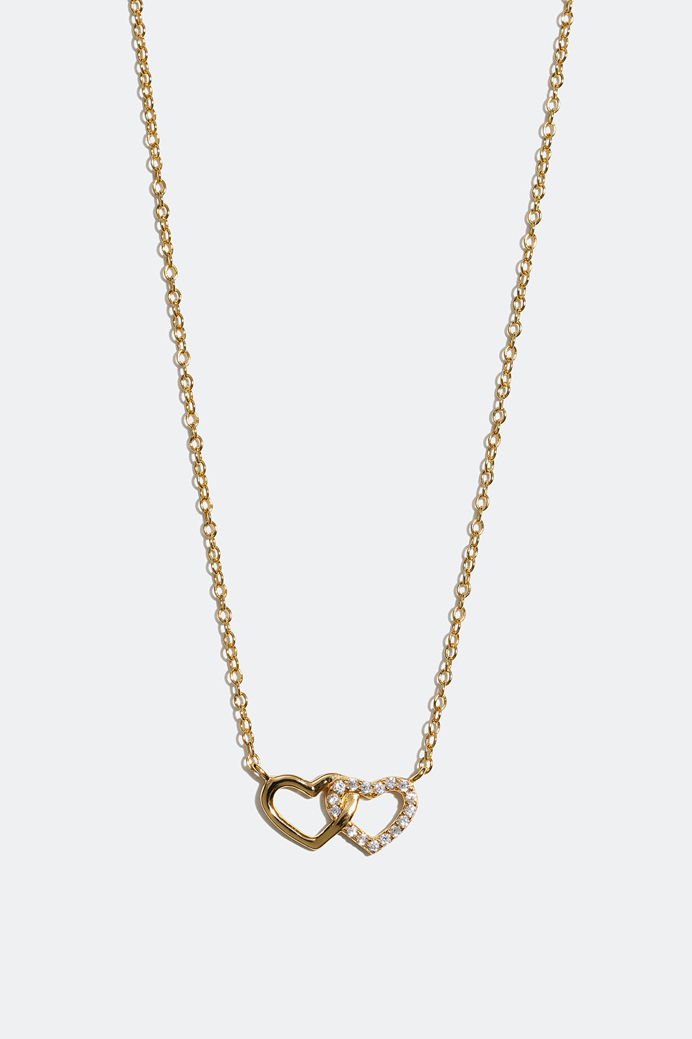 Kaulakoru, jossa 18 karaatin kultaus ja kaksi sydäntä.