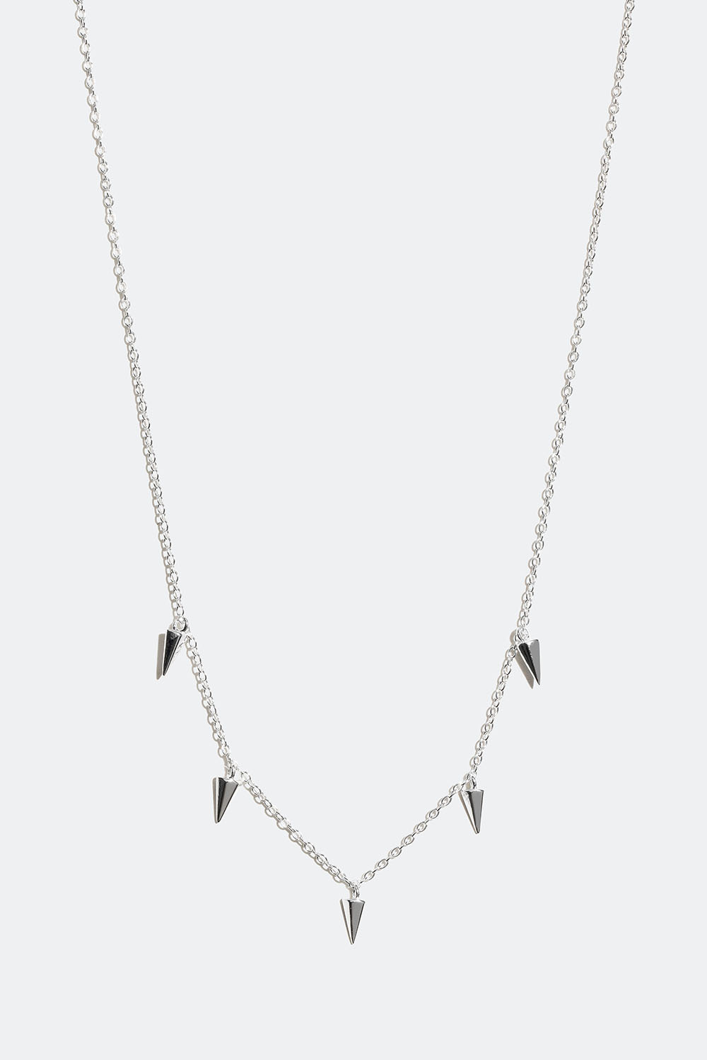 Aito hopeakaulakoru, jossa niittejä