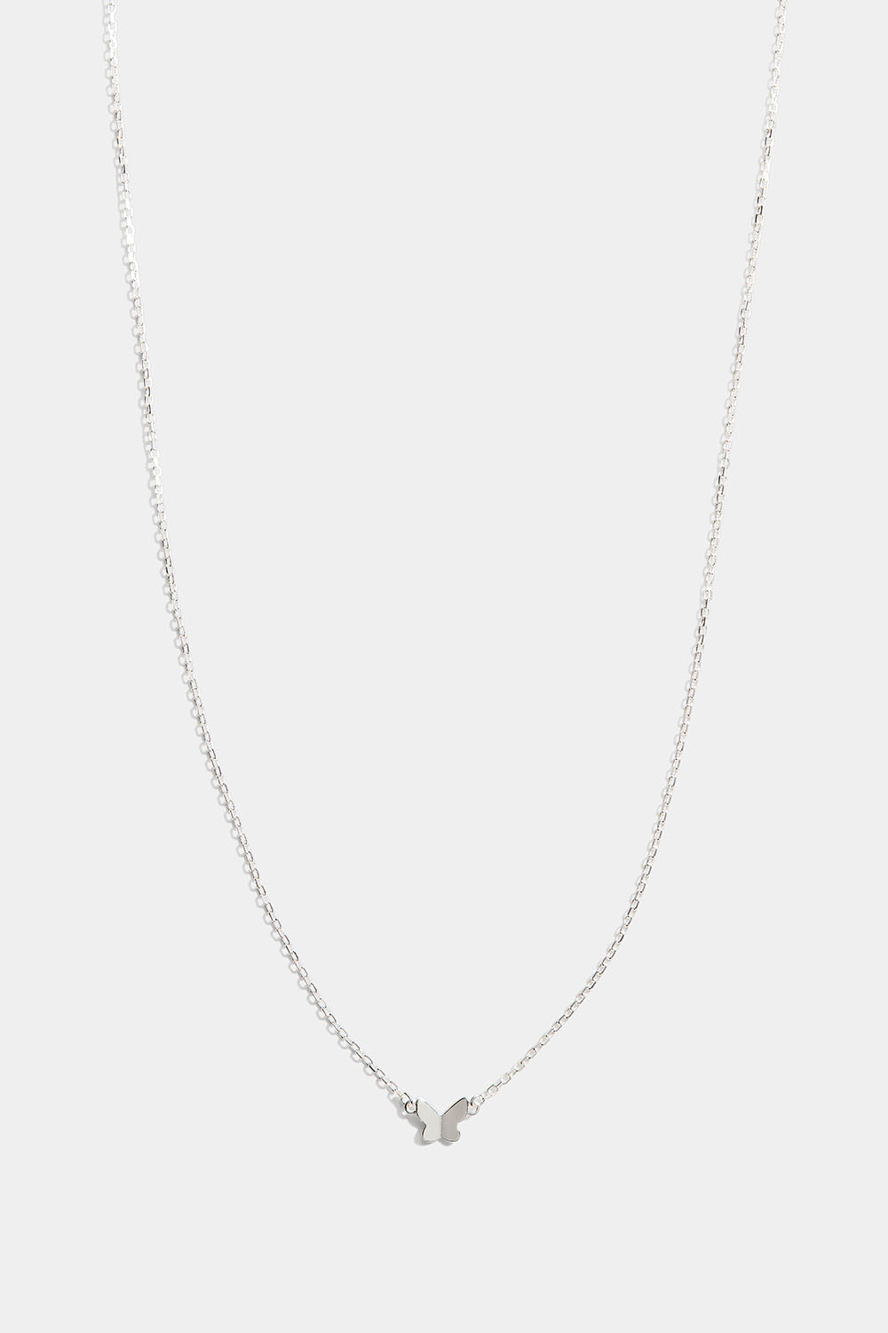 Hopeakaulakoru, jossa pieni perhonen