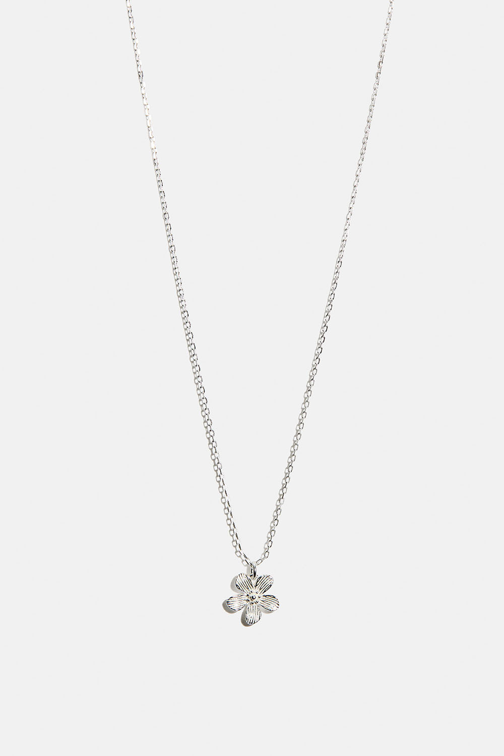 Aito hopeakaulakoru, jossa teksturoitu kukka